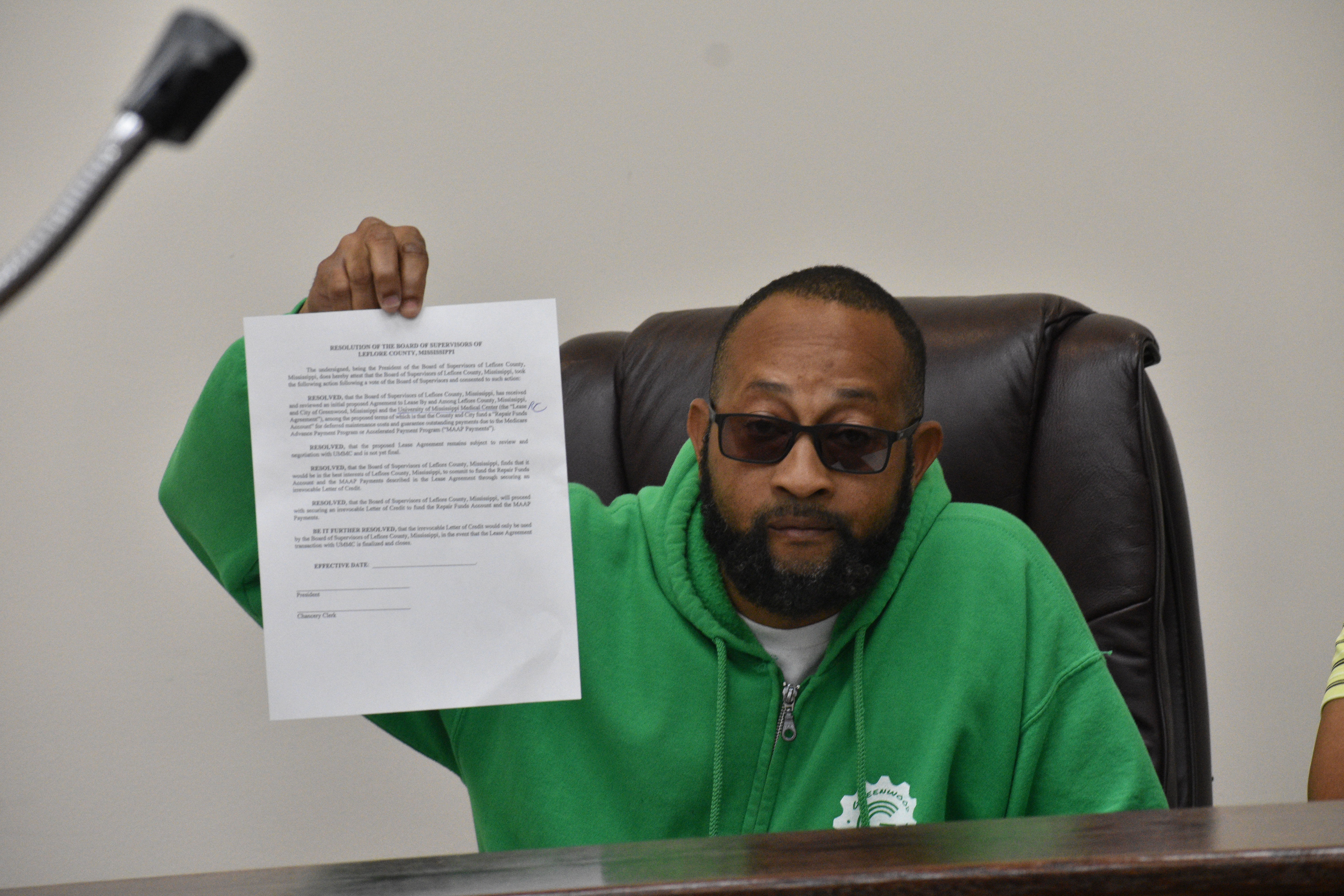 Reginald Moore holds up resolution