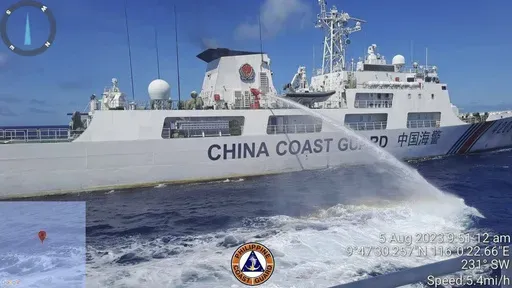 In this handout photo provided by the Philippine Coast Guard, a Chinese coast guard ship uses water canons on a Philippine Coast Guard ship near the Philippine-occupied Second Thomas Shoal, South China Sea as they blocked it's path during a re-supply mission on Aug. 5, 2023. (Philippine Coast Guard via AP, File)