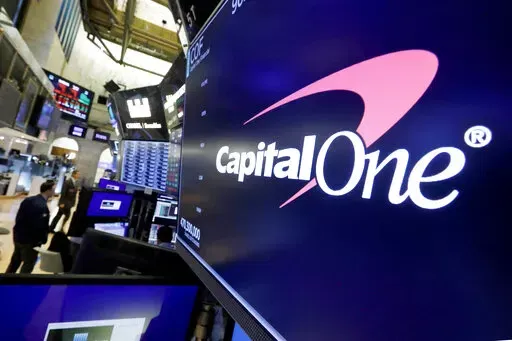The logo for Capital One Financial is displayed above a trading post on the floor of the New York Stock Exchange, July 30, 2019. A federal jury on Friday, June 17, 2022, convicted a former Seattle tech worker of several charges related to a massive hack of Capital One bank and other companies in 2019. (AP Photo/Richard Drew, File)