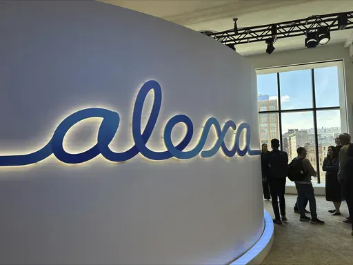 People attend an event where Amazon on Wednesday, Feb. 26, 2025, unveiled a generative-AI infused Alexa that it says will allow the popular voice assistant to have more personality, check a user’s tone and even plan romantic dates. (AP Photo/Wyatte Grantham-Philips)