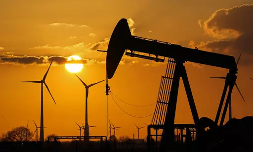 FILE -A pumpjack of Wintershall DEA extracting crude oil at an old oil field in Emlichheim, Germany, Friday, March 18, 2022. The German government said Wednesday it was triggering the early warning level for gas supplies amid concerns that Russia could cut off supplies unless it is paid in rubles. (AP Photo/Martin Meissner,file)