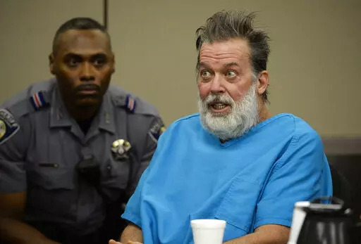 Robert Dear talks to Judge Gilbert Martinez during a court appearance in Colorado Springs, Colo., on Dec. 9, 2015. A federal judge ruled Monday, Sept. 19, 2022, that Dear, a mentally ill man charged with killing three people at a Colorado Planned Parenthood clinic in 2015 because it offered abortion services, can be forcibly medicated to try to make him competent to stand trial. The prosecution of Dear has stalled because he has been repeatedly found mentally incompetent since his arrest and has