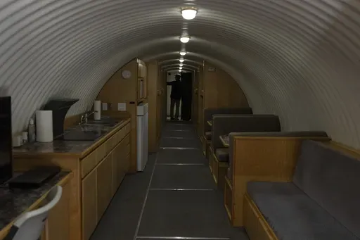 The owner, who asked not to be identified because of concerns about his privacy, turns on the lights in his underground shelter in an undisclosed Southern California city, on Dec. 16, 2024. (AP Photo/Jae C. Hong)