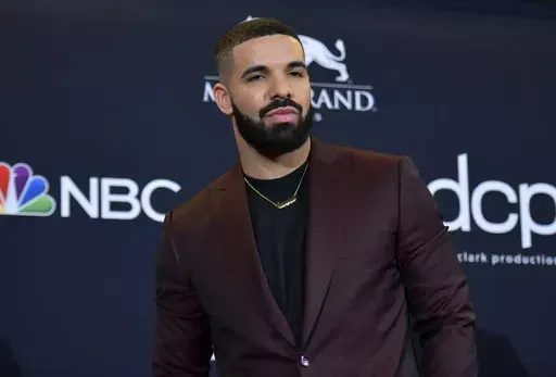 Drake poses at the Billboard Music Awards in Las Vegas on May 1, 2019. Police are investigating a shooting outside rapper Drake’s mansion that left a security guard seriously wounded. Authorities did not confirm whether Drake was at home at the time of the shooting, but said his team is cooperating. The shooting happened around 2 a.m. Tuesday in the affluent Bridle Path neighborhood of Toronto. (Photo by Richard Shotwell/Invision/AP, File)