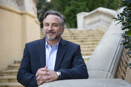 Brandon Dardeau, the new president and chief operating officer of southeast operations at Beau Rivage Resort & Casino, poses for a portrait outside the Beau Rivage in Biloxi, Miss, on Tuesday, Jan. 18, 2022. Dardeau was promoted to the position on Jan. 4 after holding various positions at the casino over the years. (Hannah Ruhoff/The Sun Herald via AP)