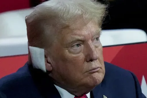 Republican presidential candidate former President Donald Trump watches during the Republican National Convention, Monday, July 15, 2024, in Milwaukee. (AP Photo/Charles Rex Arbogast)