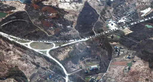This satellite image provided by Maxar Technologies shows a military convoy near Invankiv, Ukraine Monday, Feb. 28, 2022. (Satellite image ©2022 Maxar Technologies via AP)