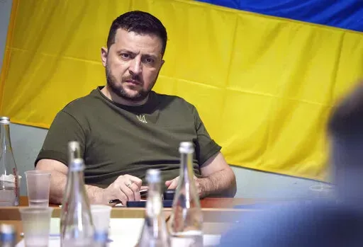 In this photo provided by the Ukrainian Presidential Press Office on Saturday, June 18, 2022, Ukrainian President Volodymyr Zelenskyy attends a meeting with military officials as he visits the war-hit Mykolaiv region. (Ukrainian Presidential Press Office via AP)