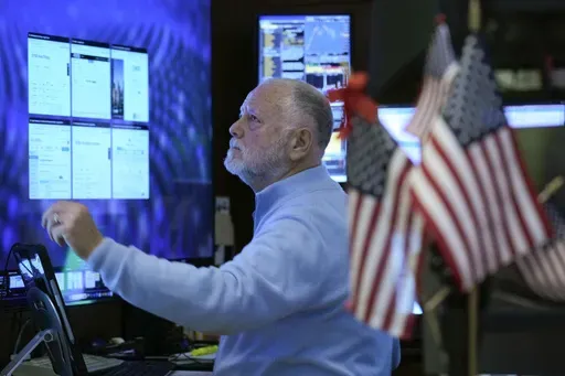 A trader works on the floor at the New York Stock Exchange in New York, Wednesday, Jan. 29, 2025. (AP Photo/Seth Wenig)