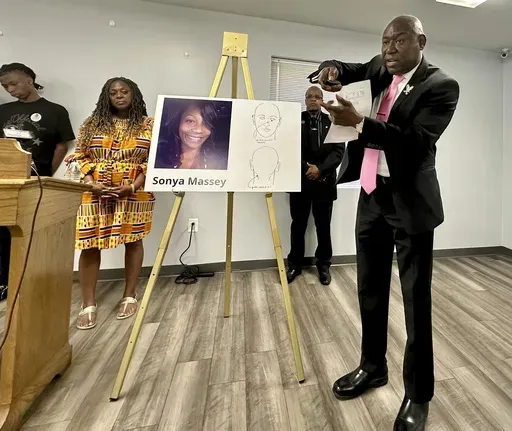 CORRECTS TO PLEADED NOT GUILTY Ben Crump, the civil rights attorney representing the family of Sonya Massey, stands next to a diagram from the slain woman's autopsy on Friday, June 26, 2024, in Springfield, Ill., and gestures to show the downward angle in which Sangamon County Sheriff's Deputy Sean Grayson shot Massey in the face early on July 6. Massey had called 911 with suspicions of a prowler near her Springfield home. Grayson has pleaded not guilty to first-degree murder and other charges. 