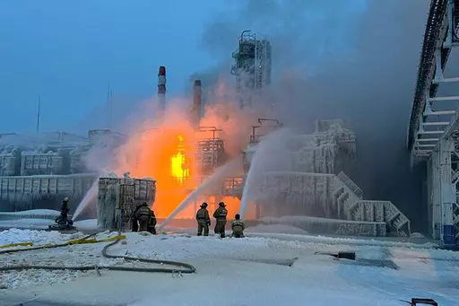 In this photo released by Telegram Channel of Leningrad Region Governor Alexander Drozdenko fire fighters extinguish the blaze at Russia's second-largest natural gas producer, Novatek in Ust-Luga, 165 kilometers southwest of St. Petersburg, Russia, Sunday, Jan. 21, 2024. Fire broke out at a chemical transport terminal at Russia's Ust-Luga port Sunday following two explosions, regional officials reported. Local media reported that the port had been attacked by Ukrainian drones, causing a gas tank