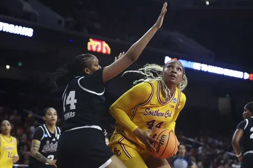 Southern California forward Kiki Iriafen (44) drives against Mississippi State forward Kayla Thomas (14) during the first half in the second round of the NCAA college basketball tournament Monday, March 24, 2025, in Los Angeles. (AP Photo/Jessie Alcheh)