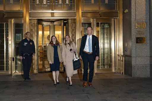 Graham Chase Robinson, center, and her attorneys Alexandra Hardin, center left, and Brent Hannafan, right, depart a federal courthouse in New York on Thursday, Nov. 9, 2023. (AP Photo/Peter K. Afriyie)