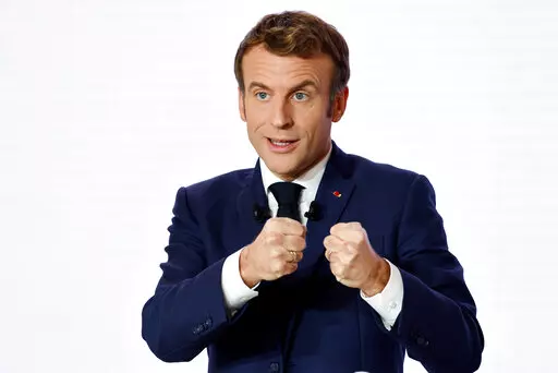 French President Emmanuel Macron gestures as he delivers a speech during a press conference on France assuming EU presidency, Thursday, Dec. 9, 2021 in Paris. President Emmanuel Macron has provoked outcries in parliament and shrill protests from election rivals by using a vulgarity to describe his strategy for pressuring vaccine refusers to get coronavirus jabs. (Ludovic Marin/Pool Photo via AP, File)