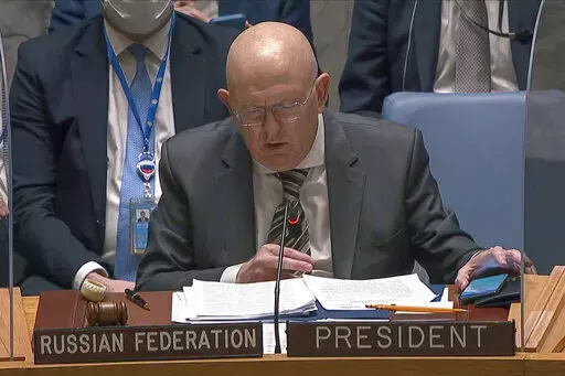 In this image from UNTV video, Vasily Nebenzya, Permanent Representative of Russia to the United Nations, speaks during an emergency meeting of the U.N. Security Council Wednesday, Feb. 23, 2022, at U.N. headquarters. (UNTV via AP)