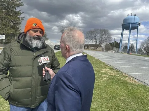 State Senate special election winner James Andrew Malone, a Democrat, does a television interview in East Petersburg, Pa., Wednesday, March 26, 2025. (AP Photo/Mark Scolforo)