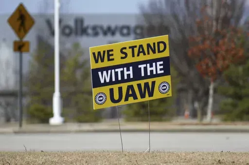 A "We stand with the UAW" sign appears outside of the Volkswagen plant in Chattanooga, Tenn., on Dec. 18, 2023. Workers at at the Tennessee factory are scheduled to finish voting Friday, April 19, 2024, on whether they want to be represented by the United Auto Workers union. (Olivia Ross/Chattanooga Times Free Press via AP, File)