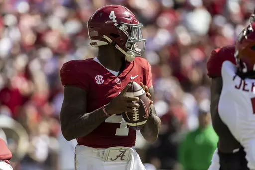 Alabama quarterback Jalen Milroe (4) looks for a passing outlet against Arkansas during the first half of an NCAA college football game, Saturday, Oct. 14, 2023, in Tuscaloosa, Ala. (AP Photo/Vasha Hunt)