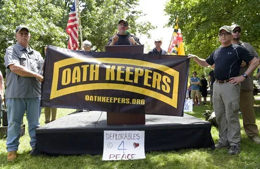 Stewart Rhodes, founder of the citizen militia group known as the Oath Keepers, center, speaks during a rally outside the White House in Washington, on June 25, 2017. The seditious conspiracy case filed this week against members and associates of the far-right Oath Keepers militia group marked the boldest attempt so far by the government to prosecute those who attacked the U.S. Capitol during the Jan. 6 riot. (AP Photo/Susan Walsh, File)