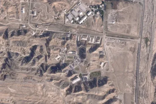 This satellite photo from Planet Labs PBC shows damaged buildings at Iran's Parchin military base outside of Tehran, Iran, Sunday, Oct. 27, 2024. An Israeli attack on Iran damaged facilities at a secretive military base southeast of the Iranian capital that experts in the past have linked to Tehran's onetime nuclear weapons program and at another base tied to its ballistic missile program, satellite photos analyzed Sunday by The Associated Press show. The damaged structures are in the bottom rig