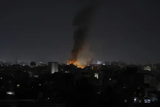 Smoke rises from a location reportedly struck by U.S. airstrikes in Sanaa, Yemen, Wednesday, March 19, 2025. (AP Photo/Osamah Abdulrahman)