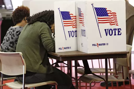 Voters work on their ballots in kiosks in Jackson, Miss., March 10, 2020. Voters in the pivotal swing state of Wisconsin, as well as Connecticut, New York and Rhode Island, will weigh in on their parties presumptive nominees in presidential primaries Tuesday, April 2, 2024. Further south, Arkansas and Mississippi voters will return to the polls to decide a small handful of legislative seats that were forced to runoffs in primaries held earlier in March. (AP Photo/Rogelio V. Solis, File)