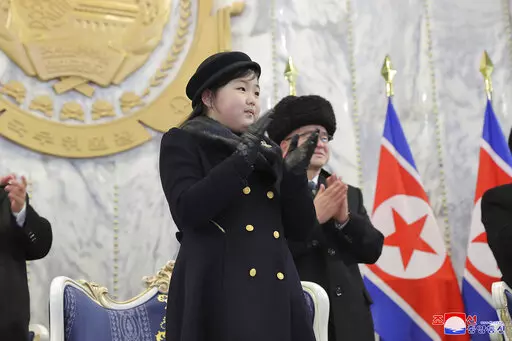 In this photo provided by the North Korean government, the daughter, reportedly named Kim Ju Ae, of North Korean leader Kim Jong Un, attends a military parade to mark the 75th founding anniversary of the Korean People's Army on Kim Il Sung Square in Pyongyang, North Korea on Feb. 8, 2023. Independent journalists were not given access to cover the event depicted in this image distributed by the North Korean government. The content of this image is as provided and cannot be independently verified.