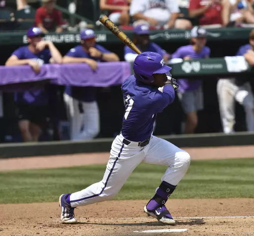 TCU's Austin Davis connects with two-run single against Arkansas during the second inning of an NCAA college baseball tournament regional championship game in Fayetteville, Ark. Monday, June 5, 2023. (Andy Shupe/The Northwest Arkansas Democrat-Gazette via AP)