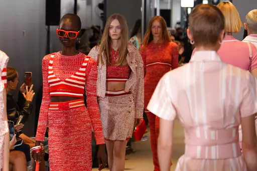 Models wear creations as part of the Benetton women's Spring Summer 2023 collection presented in Milan, Italy, Sunday, Sept. 25, 2022. (AP Photo/Alberto Pezzali)