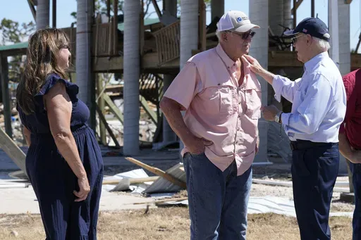 President Joe Biden, right, greets people in Keaton Beach, Fla., Oct. 3, 2024, during his tour of areas impacted by Hurricane Helene. (AP Photo/Susan Walsh, File)