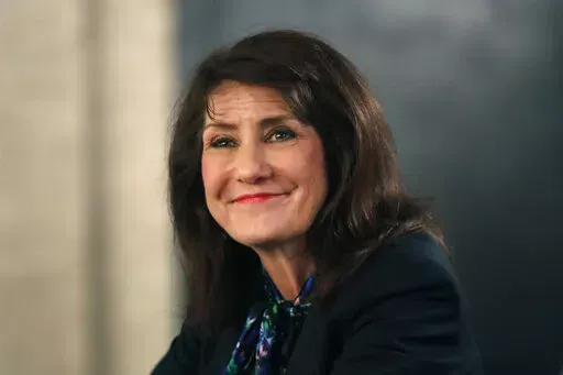 In this March 9, 2020, photo, Democrat Marie Newman campaigns in Chicago. A congressional ethics watchdog has concluded that U.S. Reps. Marie Newman of Illinois and Doug Lamborn of Colorado may have violated federal law, prompting reviews from the House Ethics Committee. (AP Photo/Charles Rex Arbogast, File)