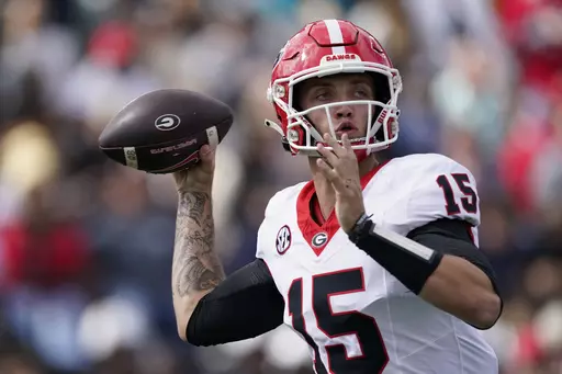 Georgia quarterback Carson Beck (15) looks to throw a pass against Vanderbilt in the second half of an NCAA college football game Saturday, Oct. 14, 2023, in Nashville, Tenn. (AP Photo/George Walker IV)
