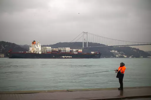Cargo ship Oakland crosses the Bosphorus strait towards the Marmara sea after departing from Russia's Novorossiysk port, in Istanbul, Tuesday, March 1, 2022. Turkey, which is trying to balance its support for Ukraine with its fragile economic ties to Russia, said Monday it is implementing an international convention that allows the country to shut down the straits at the entrance of the Black Sea to warships, to avoid an escalation of the conflict. (AP Photo/Francisco Seco, File)