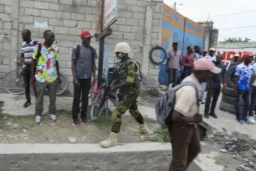 A Kenyan police officer patros an area near the international airport in Port-au-Prince, Haiti, Wednesday, July 3, 2024. (AP Photo/Odelyn Joseph)