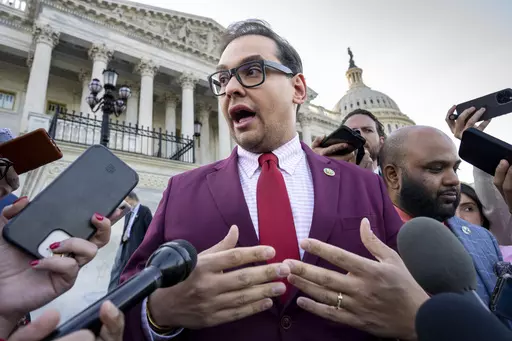 Rep. George Santos, R-N.Y., speaks to reporters outside after an effort to expel him from the House, at the Capitol in Washington, Wednesday, May 17, 2023. Santos wants to protect family members by asking that the courts keep his bond cosigners secret as he fights criminal charges, his lawyer told a Long Island federal judge Friday, June 9, as he asked her to reverse a magistrate judge's decision to make the names public. (AP Photo/J. Scott Applewhite, File)