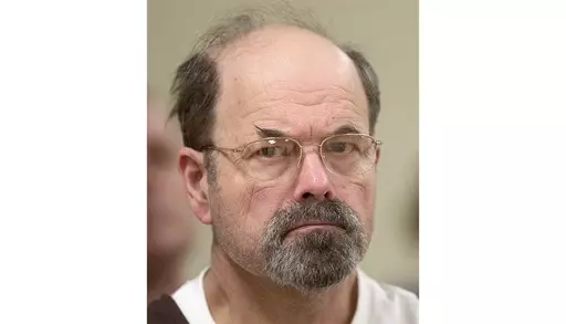Convicted BTK killer Dennis Rader listens during a court proceeding, Oct. 12, 2005, in El Dorado, Kan. On Wednesday, Aug. 23, 2023, authorities in Oklahoma and Missouri said they are investigating whether the BTK serial killer was responsible for other homicides, with their search leading them to dig on Tuesday, Aug. 22, near his former Kansas property. (Travis Heying/The Wichita Eagle via AP, Pool, File)