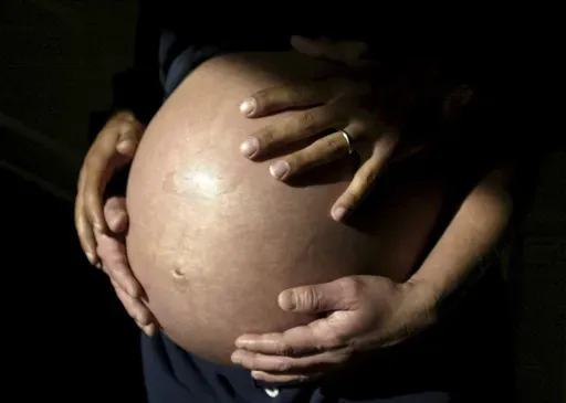 A couple awaits the arrival of their first child in Carlsbad, Calif., in November 2005. (AP Photo/Julie Busch, File)