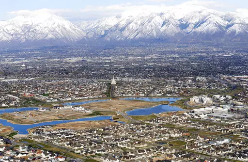 Homes in suburban Salt Lake City are shown, April 13, 2019. According to estimates released Thursday, Dec. 22, 2022, by the U.S. Census Bureau, the U.S. population grew by 1.2 million people this year, with growth largely driven by international migration, and the nation now has 333.2 million residents. (AP Photo/Rick Bowmer, File)