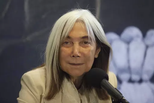 Maria Kodama, widow and heiress of Argentine author Jorge Luis Borges attends a press conference at the Palacio de Bellas Artes in Mexico City, July 30, 2012. Kodama has died on Sunday, March 26, 2023. (AP Photo/Alexandre Meneghini, File)