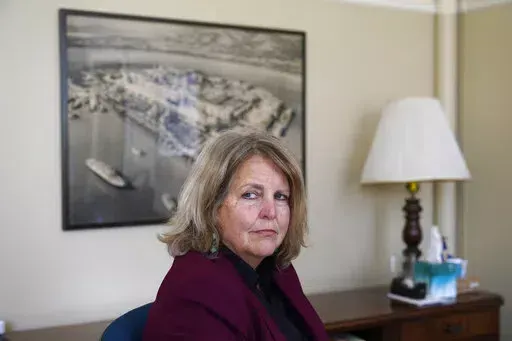 Sherry Williams, executive director of One Treasure Island, poses for a photo at her office on Tuesday, April 5, 2022, in San Francisco. Business Email Compromise scams are a type of crime where criminals hack into email accounts, pretend to be someone they're not and fool victims into sending money to places they aren't supposed to. In the case of Williams, the San Francisco nonprofit director, thieves hacked the email account of the nonprofit's bookkeeper then inserted themselves into a long e