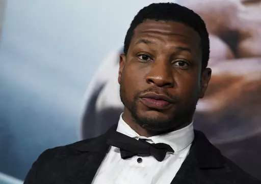 Jonathan Majors arrives at the premiere of "Creed III" on Feb. 27, 2023, at TCL Chinese Theatre in Los Angeles. The arrest of actor Majors on Saturday, March 25, 2023, has upended the Army’s newly launched advertising campaign that was aimed at reviving the service’s struggling recruiting numbers. (Photo by Jordan Strauss/Invision/AP, File)