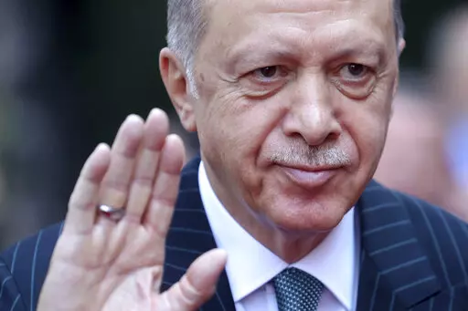 Turkey's President Recep Tayyip Erdogan waves to the crowd during a welcome ceremony in Sarajevo, Bosnia, on Sept. 6, 2022. Turkey's president has suggested his country might approve Finland's application for NATO membership before taking any action on Sweden's, while the Turkish government on Saturday Jan. 28, 2023 issued a travel warning for European countries due to anti-Turkish demonstrations and what it described as Islamophobia. (AP Photo/Armin Durgut, File)