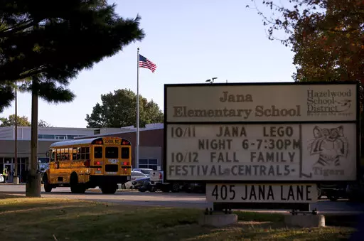 A school bus arrives at Jana Elementary School on Oct. 17, 2022, in Florissant, Mo. Another round of testing found no harmful radioactive contamination at the Missouri elementary school, leaving school board members to wonder if there really is any risk at the now-shuttered school. (Christian Gooden/St. Louis Post-Dispatch via AP, File)