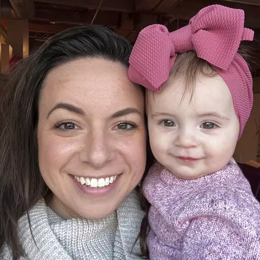 This March 2022 photo provided by Morgan Fabry shows her with her daughter in Chicago. Some U.S. moms looking for baby formula that is in short supply  are dealing with another layer of stress - people asking why they don't just breastfeed. Exclusive breastfeeding is recommended for the first six months of life by major medical entities like the World Health Organization, giving rise to the saying, “breast is best.” But breastfeeding doesn’t work for everyone, and that mantra is only addin