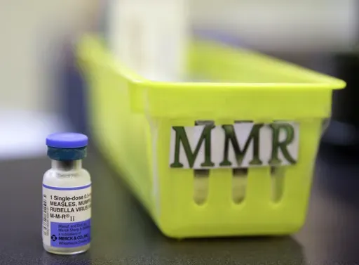A vial of a measles, mumps and rubella vaccine sits on a countertop at a pediatrics clinic in Greenbrae, Calif., on Feb. 6, 2015. (AP Photo/Eric Risberg, File)