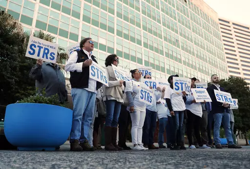 Short term rental property owners protest outside City Hall in New Orleans, Jan. 10, 2019. A key provision of a city law restricting short term, Airbnb-style rentals in New Orleans has been ruled unconstitutional by a federal appeals court. The provision effectively limits short-term rental licenses to people living in the city. The 5th U.S. Circuit Court of Appeals ruled Monday, Aug. 22, 2022 that the provision unconstitutionally excludes out-of-state property owners from having licenses. (AP P