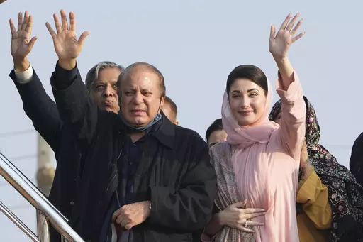 Pakistan's former Prime Minister Nawaz Sharif, center, and his daughter Maryam Nawaz, right, waves to their supporters as they arrive to address an election campaign rally in Hafizabad, Pakistan, Thursday, Jan. 18, 2024. More than 120 million voters in Pakistan get to elect a new parliament on Thursday. The elections are the twelfth in the country's 76-year history, which has been marred by economic crises, military takeovers and martial law, militancy, political upheavals and wars with India. (