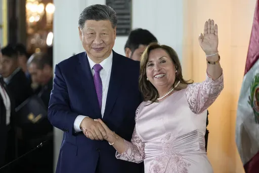 Peru's President Dina Boluarte, right, and Chinese President Xi Jinping shake hands after a ceremony to virtually inaugurate a Chinese-funded port in the city of Chancay, at the government palace in Lima, Peru, Thursday, Nov. 14, 2024. (AP Photo/Fernando Vergara)