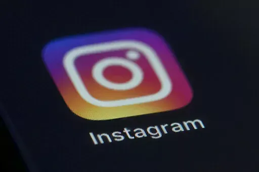 This photo shows the Instagram app icon on the screen of a mobile device on Aug. 23, 2019. Russian regulators said Friday, March 11, 2022, that internet users in the country will be blocked from accessing Instagram because it's being used to call for violence against Russian soldiers, in Moscow's latest move to tighten up access to foreign social platforms. (AP Photo/Jenny Kane, File)
