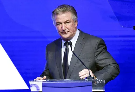 Alec Baldwin performs emcee duties at the Robert F. Kennedy Human Rights Ripple of Hope Award Gala at New York Hilton Midtown on Dec. 9, 2021, in New York.  Baldwin has surrendered his cellphone as part of the investigation into a fatal shooting on a New Mexico film set last fall. A Santa Fe County Sheriff’s Office spokesman says Baldwin’s phone was turned over Friday, Jan. 14, 2022, to authorities in New York's Suffolk County and that information from the phone will be provided to investiga